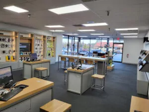 Auburn, California Verizon store interior wide view of store showing clean customer assistance and tables and product displays on walls. 