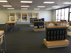 Verizon store interior showing iPhone displays and tablet displays 